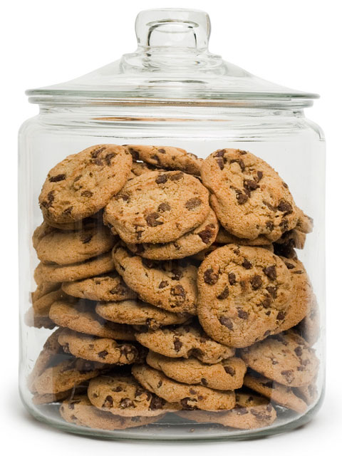 glass cookie jar filled with chocolate chip cookies